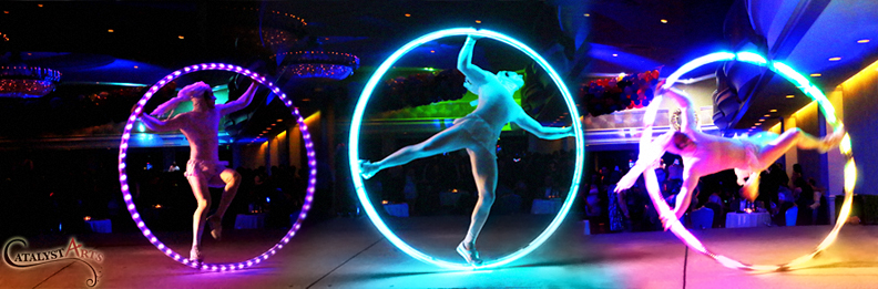 LED Cyr Wheel Circus Stage Performer- bookable by www.catalystarts.com in California