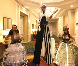 circus entertainment package by Catalyst Arts with juggler, stilts, tarot, temp tattoos & champagne skirts