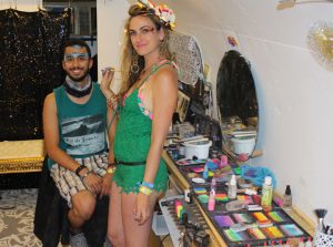 Audette Sophia of Catalyst Arts face painting guy inside airstream makeup trailer- Airship at EDC Vegas VIP area 2016