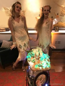 20's Party classic bellhop attendants & green absinthe fairy flappers by Catalyst Arts Entertainment in CA