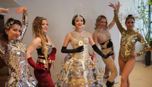 Five Luxe Showgirls & event performers from Catalyst Arts Entertainment wearing champagne skirt and mirror costumes