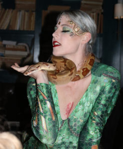 Snake Charmer-dancer holding a brown snake