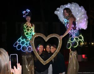 Glow Stilt Walkers with our Lit Heart Frame at an Oakland event