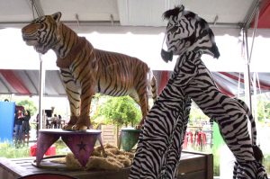 Zebra Stiltwalker with Tiger Statue