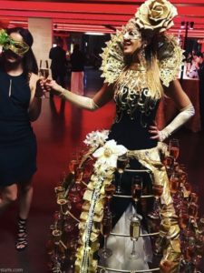 Gold Rose Masquerade Champagne Skirt Showgirl Handing out Champagnes to guests