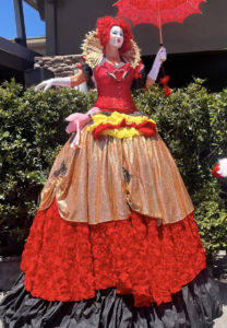 Red Queen Stilt Walker in Wonderland + Catalyst Arts