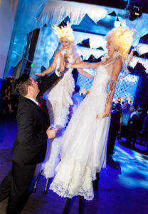 Snow Queen Stiltwalker High Five with guest