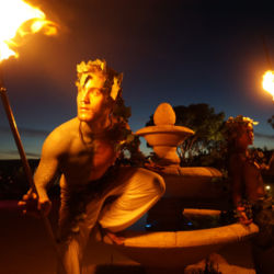 Living Statues holding fire