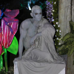 Stone Living Statue on post