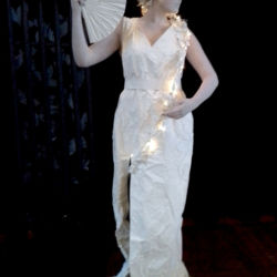 Livinfg Statue holding a fan