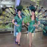 Two Rainforest Peacock Showgirls in a green peacock costume